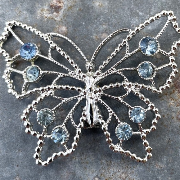 Jewelry - Vintage silver tone airy Butterfly Brooch w/ blue rhinestones